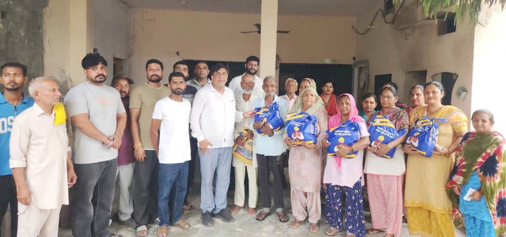 MLA Jimpa distributed ration kits to the needy families of village Bassi Purani
